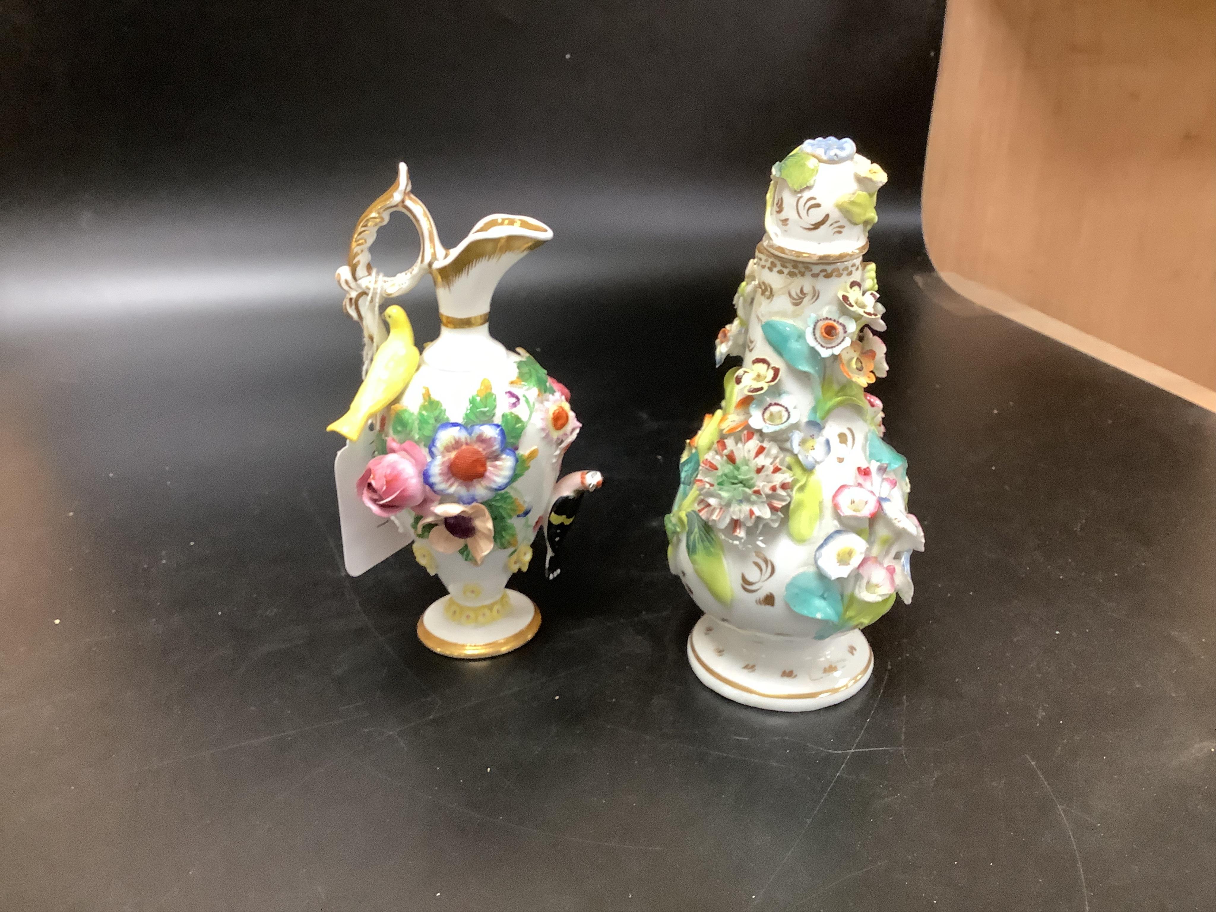 A group of English porcelain flower encrusted scent bottles and yours, Coalport, Minton etc., c.1830-50 together with Continental porcelain figures a wall pocket etc, largest 26cm high